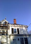 Brick chimney replaced from the roof line up.