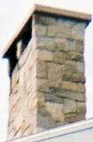 stone capped stone chimney