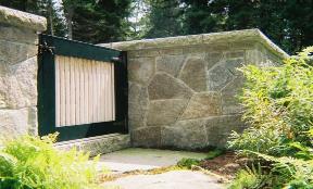 granite privacy wall with entry gate